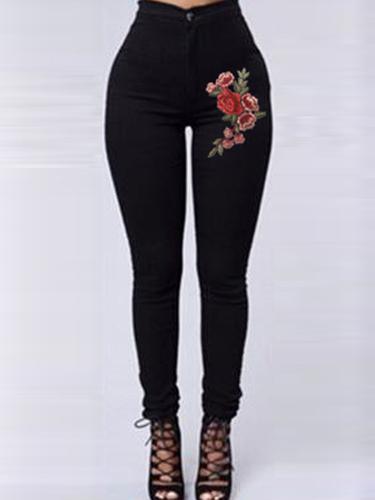 Rode bloemen borduurwerk skinny jeans